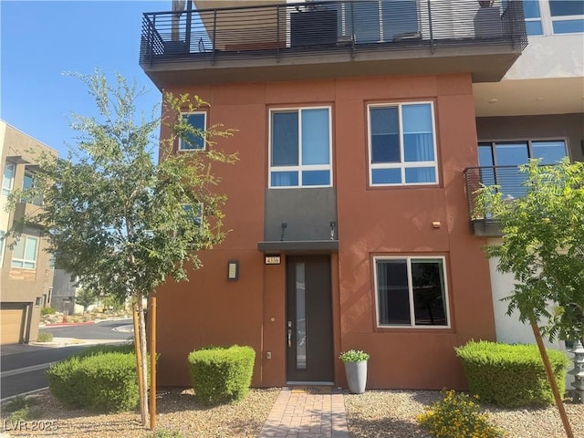 4336 Guava Ct, Las Vegas, NV 89135 - entrance to property with a balcony and stucco siding
