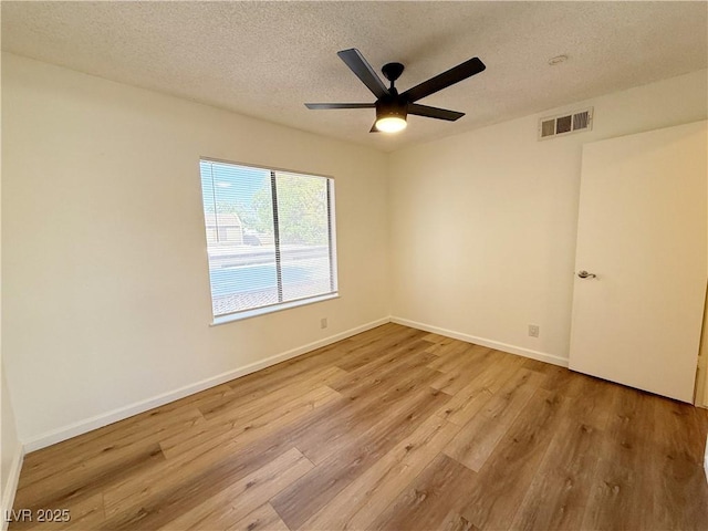 3270 Liahona Way, Las Vegas, NV 89121 - empty room featuring light wood-style floors, a textured ceiling, and a ceiling fan