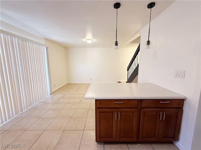 3270 Liahona Way, Las Vegas, NV 89121 - kitchen with light tile patterned floors, decorative light fixtures, and a peninsula