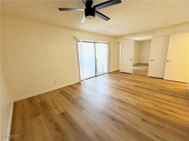 3270 Liahona Way, Las Vegas, NV 89121 - unfurnished room with light wood-style floors, a textured ceiling, and ceiling fan