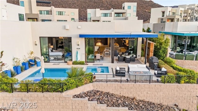 387 Solitude Peak Ln, Henderson, NV 89012 - back of house featuring a patio area and stucco siding
