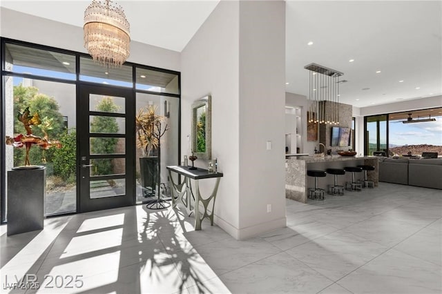 387 Solitude Peak Ln, Henderson, NV 89012 - foyer with a chandelier, recessed lighting, a high ceiling, and marble finish flooring