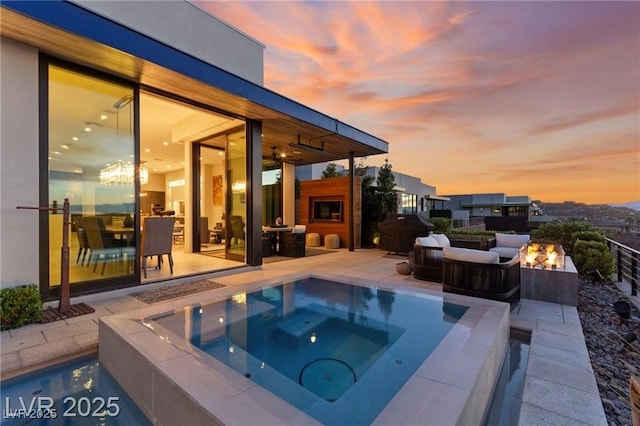387 Solitude Peak Ln, Henderson, NV 89012 - outdoor pool featuring an in-ground hot tub, an outdoor fire pit, and a patio