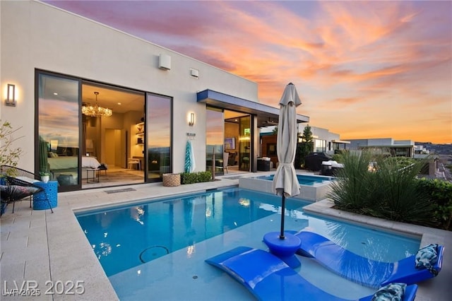 387 Solitude Peak Ln, Henderson, NV 89012 - view of pool with a patio area and a pool with connected hot tub