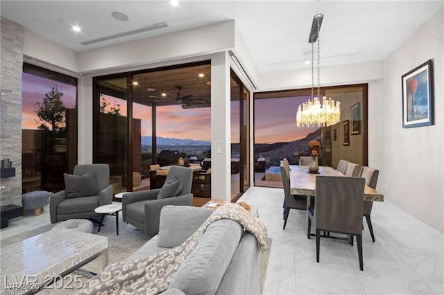 387 Solitude Peak Ln, Henderson, NV 89012 - dining area with a chandelier and a ceiling fan