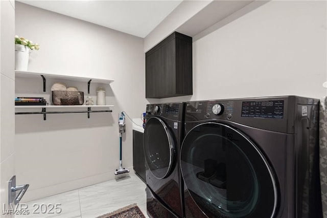 387 Solitude Peak Ln, Henderson, NV 89012 - laundry area with washing machine and dryer and light marble finish floors