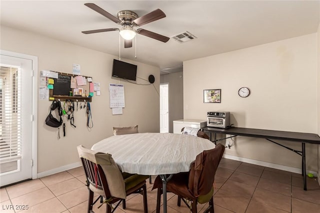 4168 Wendy Ln, Las Vegas, NV 89115 - dining area featuring light tile patterned floors and a ceiling fan