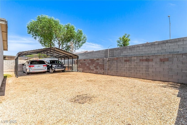 4168 Wendy Ln, Las Vegas, NV 89115 - view of yard featuring a carport and dirt driveway