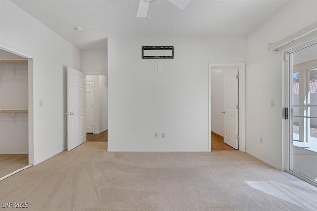 4828 Marco Polo St, North Las Vegas, NV 89031 - unfurnished bedroom featuring light carpet, a spacious closet, access to exterior, and a ceiling fan