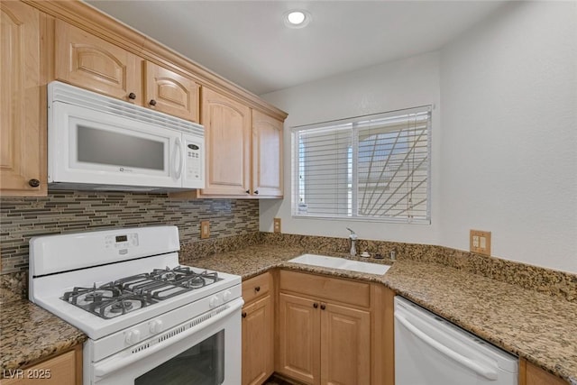 4828 Marco Polo St, North Las Vegas, NV 89031 - kitchen featuring white appliances, light brown cabinets, decorative backsplash, light stone counters, and recessed lighting