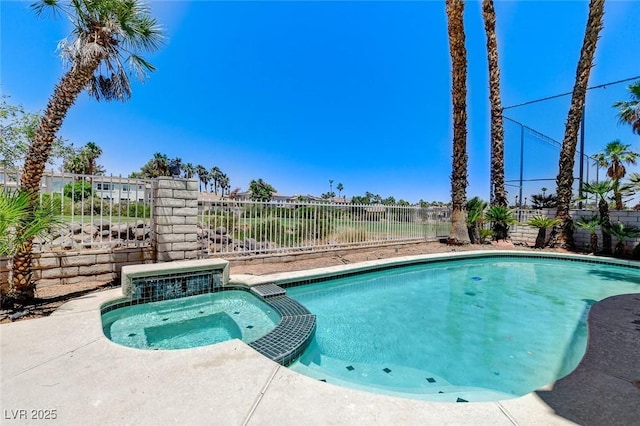 2496 Ram Crossing Way, Henderson, NV 89074 - view of swimming pool featuring a fenced backyard and a pool with connected hot tub