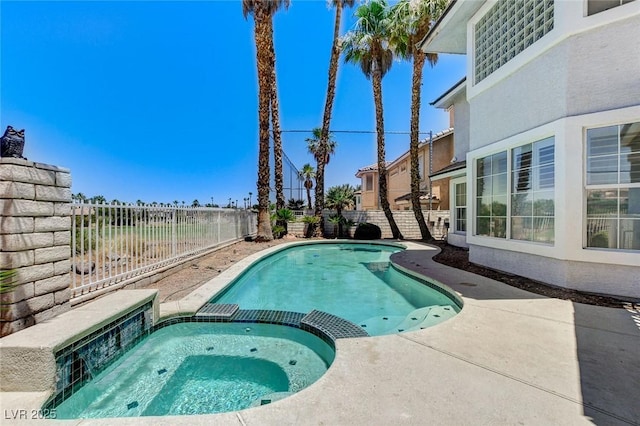 2496 Ram Crossing Way, Henderson, NV 89074 - view of swimming pool featuring a fenced backyard, a pool with connected hot tub, and a patio