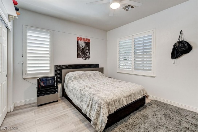 2496 Ram Crossing Way, Henderson, NV 89074 - bedroom with wood finished floors, a closet, and ceiling fan