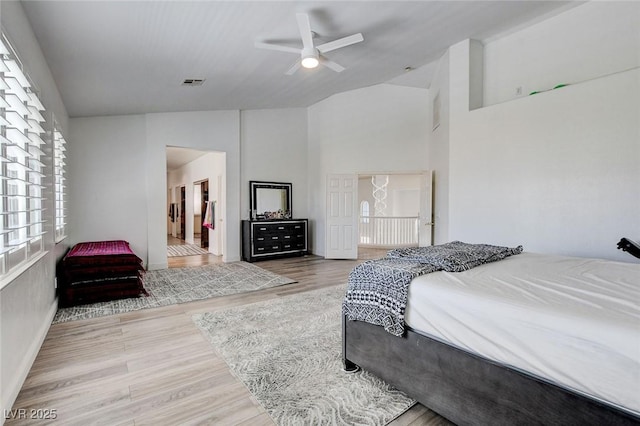 2496 Ram Crossing Way, Henderson, NV 89074 - bedroom featuring wood finished floors, high vaulted ceiling, and ceiling fan