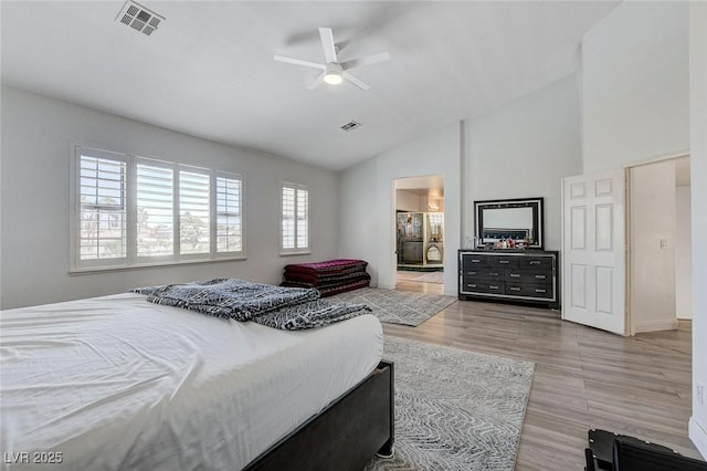 2496 Ram Crossing Way, Henderson, NV 89074 - bedroom featuring high vaulted ceiling, wood finished floors, ensuite bathroom, and ceiling fan