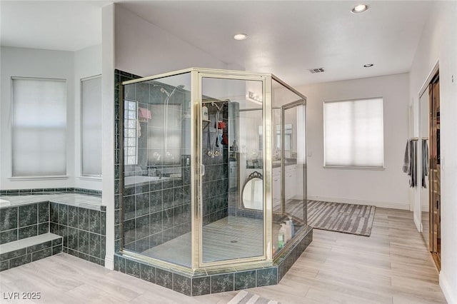 2496 Ram Crossing Way, Henderson, NV 89074 - full bath featuring recessed lighting, a shower stall, and wood finished floors