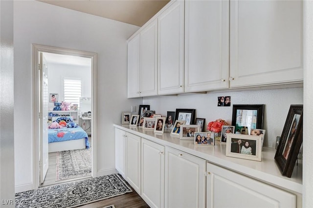 2496 Ram Crossing Way, Henderson, NV 89074 - bar area with dark wood-type flooring and baseboards