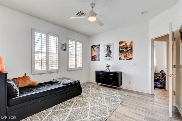 2496 Ram Crossing Way, Henderson, NV 89074 - bedroom with light wood finished floors and ceiling fan