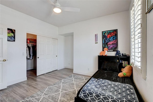2496 Ram Crossing Way, Henderson, NV 89074 - bedroom with wood finished floors, multiple windows, a closet, and ceiling fan