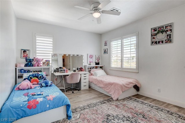 2496 Ram Crossing Way, Henderson, NV 89074 - bedroom with wood finished floors and ceiling fan