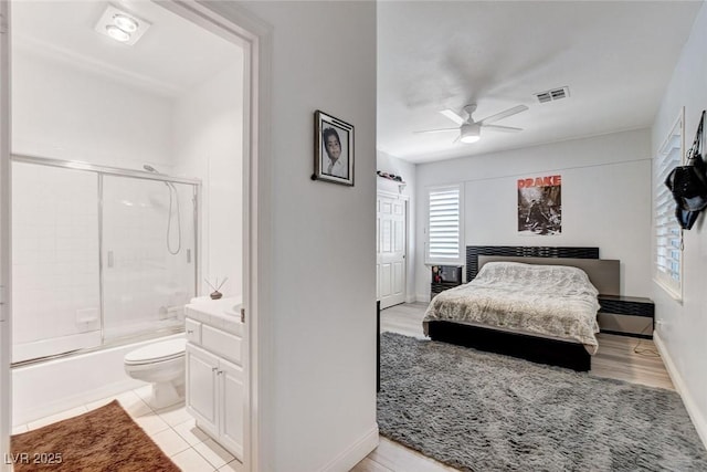 2496 Ram Crossing Way, Henderson, NV 89074 - bedroom featuring connected bathroom and a ceiling fan