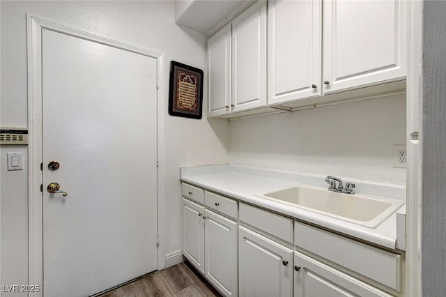 2496 Ram Crossing Way, Henderson, NV 89074 - washroom featuring wood finished floors and a sink