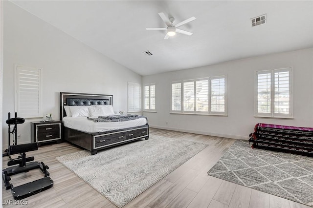 2496 Ram Crossing Way, Henderson, NV 89074 - bedroom with multiple windows, high vaulted ceiling, wood finished floors, and a ceiling fan