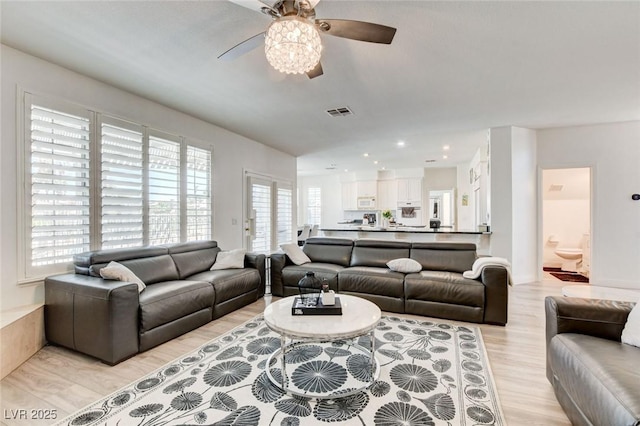 2496 Ram Crossing Way, Henderson, NV 89074 - living area featuring a ceiling fan, light wood-style floors, and recessed lighting