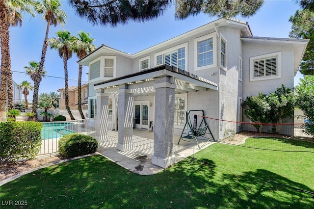 2496 Ram Crossing Way, Henderson, NV 89074 - back of property featuring stucco siding and a patio