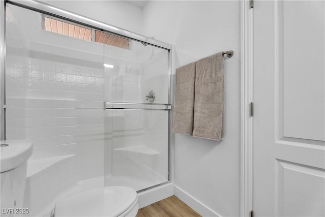 9047 Harbor Wind Ave, Las Vegas, NV 89178 - bathroom featuring a stall shower and wood finished floors