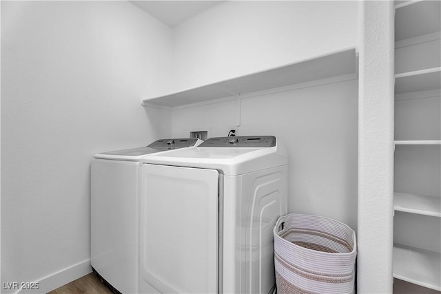 9047 Harbor Wind Ave, Las Vegas, NV 89178 - laundry room featuring washing machine and dryer and wood finished floors