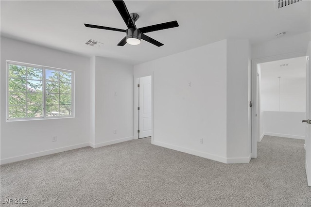 9047 Harbor Wind Ave, Las Vegas, NV 89178 - spare room featuring light carpet, a ceiling fan, and a smoke detector