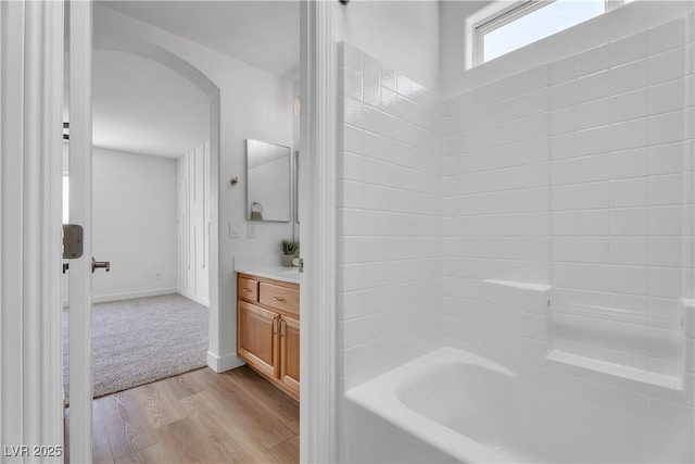 9047 Harbor Wind Ave, Las Vegas, NV 89178 - bathroom featuring vanity, wood finished floors, and bathing tub / shower combination