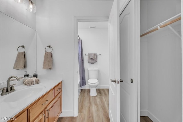 9047 Harbor Wind Ave, Las Vegas, NV 89178 - full bathroom featuring vanity, wood finished floors, and a shower with curtain