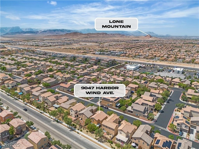 9047 Harbor Wind Ave, Las Vegas, NV 89178 - aerial perspective of suburban area with a mountainous background