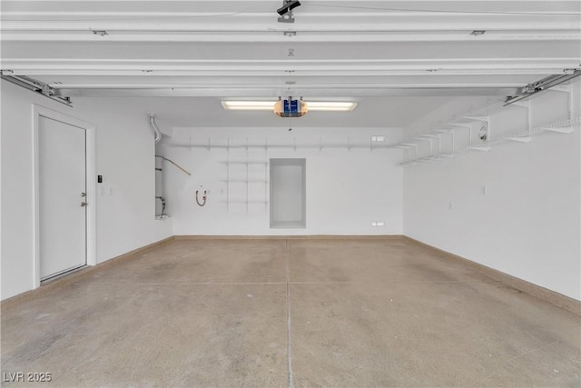 9047 Harbor Wind Ave, Las Vegas, NV 89178 - garage featuring a garage door opener and baseboards