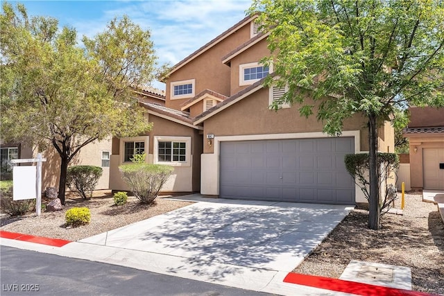 9047 Harbor Wind Ave, Las Vegas, NV 89178 - view of front of property featuring stucco siding, driveway, and an attached garage
