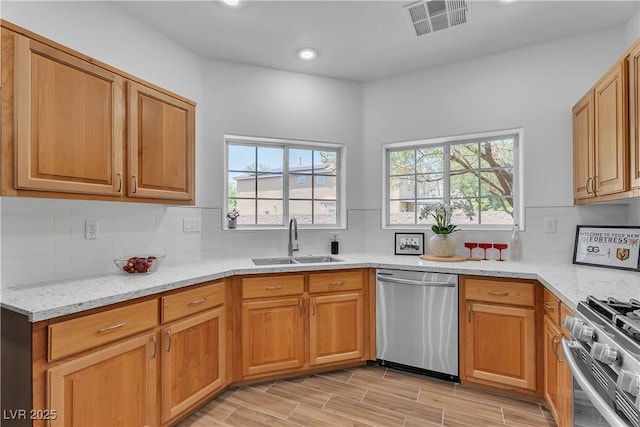 9047 Harbor Wind Ave, Las Vegas, NV 89178 - kitchen with appliances with stainless steel finishes, light stone countertops, healthy amount of natural light, recessed lighting, and decorative backsplash