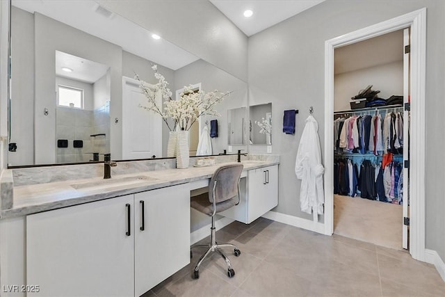 112 Springbough Ln, Las Vegas, NV 89138 - full bathroom with double vanity, a walk in shower, a spacious closet, tile patterned flooring, and recessed lighting