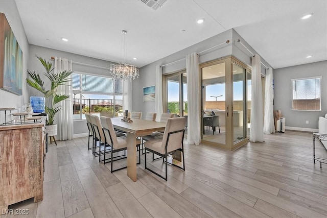 112 Springbough Ln, Las Vegas, NV 89138 - dining room featuring plenty of natural light, a chandelier, light wood finished floors, and recessed lighting