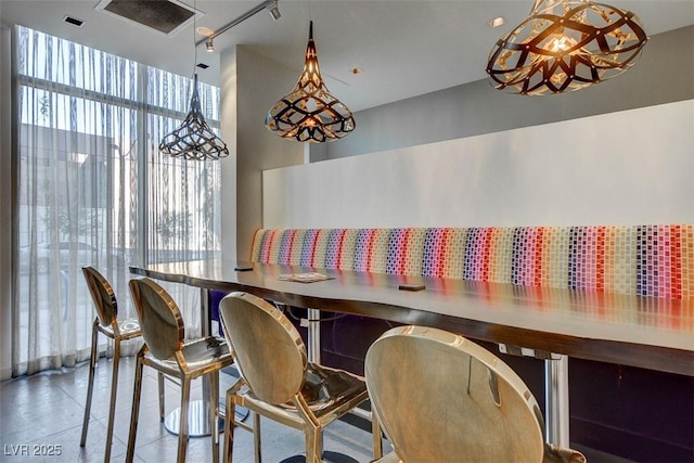 353 E Bonneville Ave Unit 449, Las Vegas, NV 89101 - dining space with track lighting and tile patterned floors