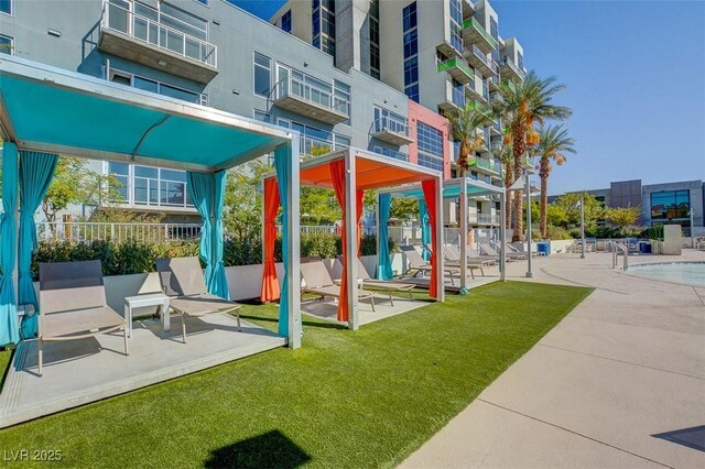 353 E Bonneville Ave Unit 449, Las Vegas, NV 89101 - view of play area featuring a patio area and a community pool