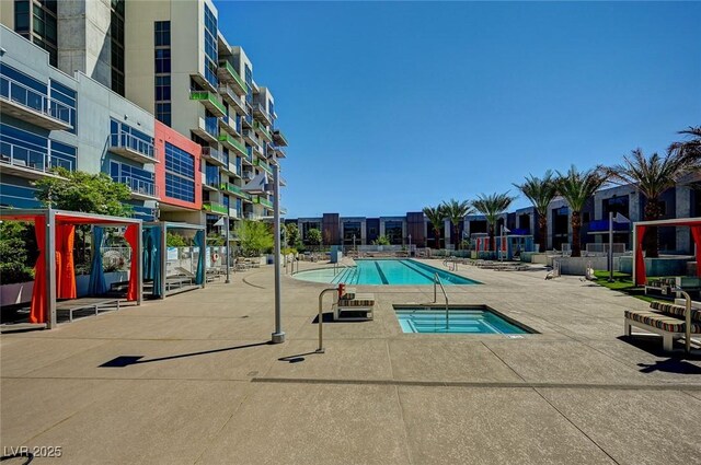 353 E Bonneville Ave Unit 449, Las Vegas, NV 89101 - community pool with a patio and a hot tub