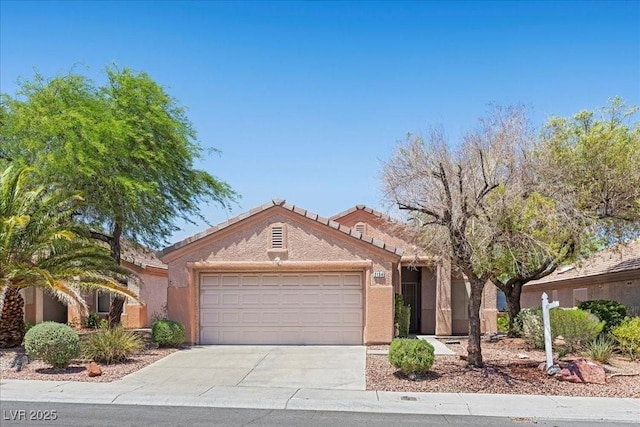 2154 Eagle Sticks Dr, Henderson, NV 89012 - view of front of property with a garage, concrete driveway, and stucco siding