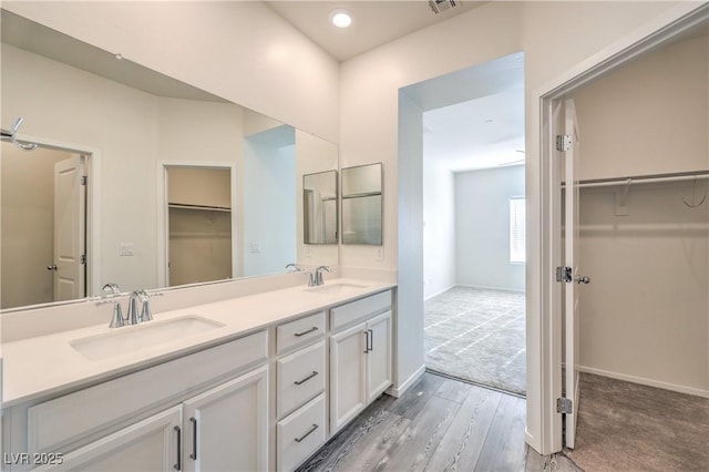 545 Thea St Unit 1315, Henderson, NV 89052 - full bath featuring double vanity, a spacious closet, and wood finished floors