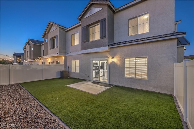 545 Thea St Unit 1315, Henderson, NV 89052 - rear view of property with stucco siding, a standing seam roof, a fenced backyard, and a metal roof