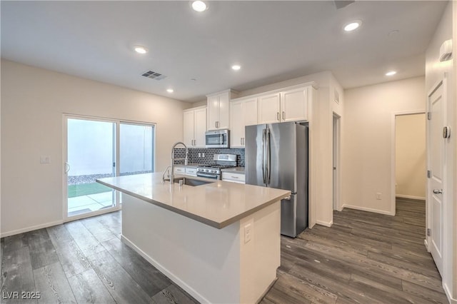 545 Thea St Unit 1315, Henderson, NV 89052 - kitchen featuring stainless steel appliances, a kitchen island with sink, white cabinetry, dark wood-style floors, and recessed lighting