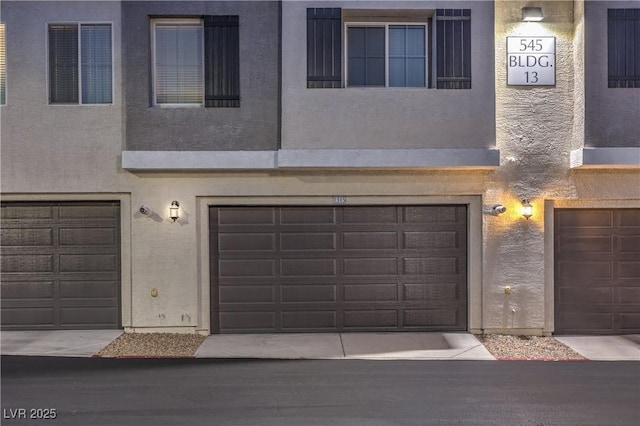 545 Thea St Unit 1315, Henderson, NV 89052 - view of property with a garage and stucco siding