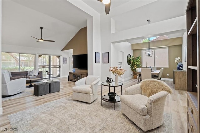 9540 Eagle Valley Dr, Las Vegas, NV 89134 - living area with a ceiling fan, high vaulted ceiling, and wood finished floors
