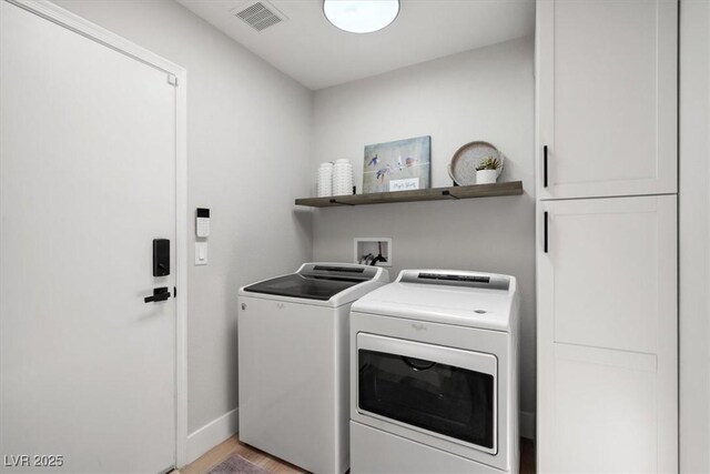 9540 Eagle Valley Dr, Las Vegas, NV 89134 - laundry area with washer and dryer and light wood finished floors